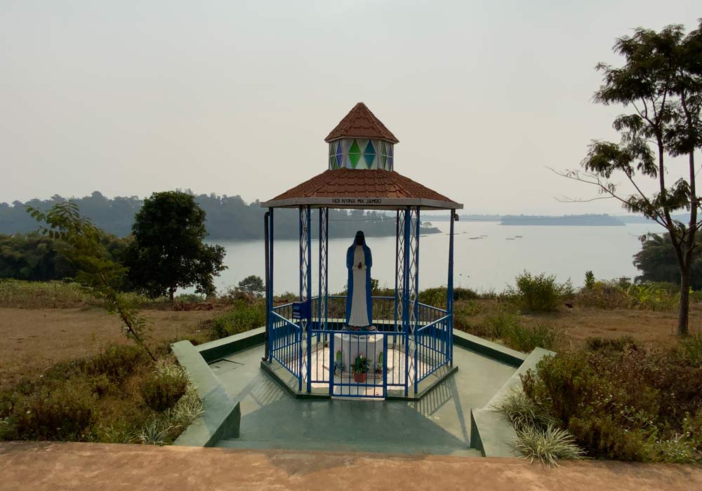 Statue of Our Lady of Kibeho next to the lake shore