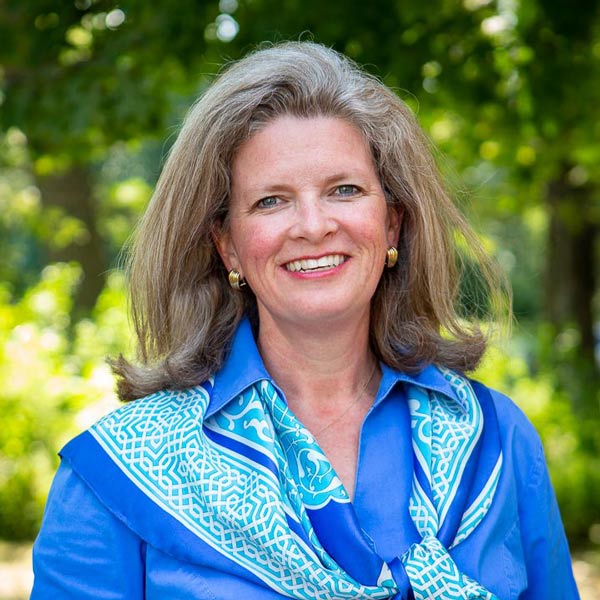 Betsy Ackerson headshot in front of a tree